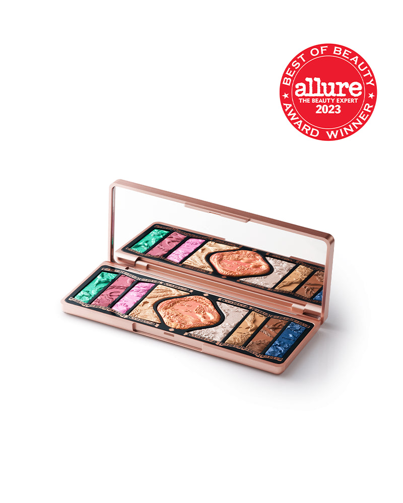 Colorful eyeshadow palette with mirror and intricate embossed designs, Allure award winner badge.